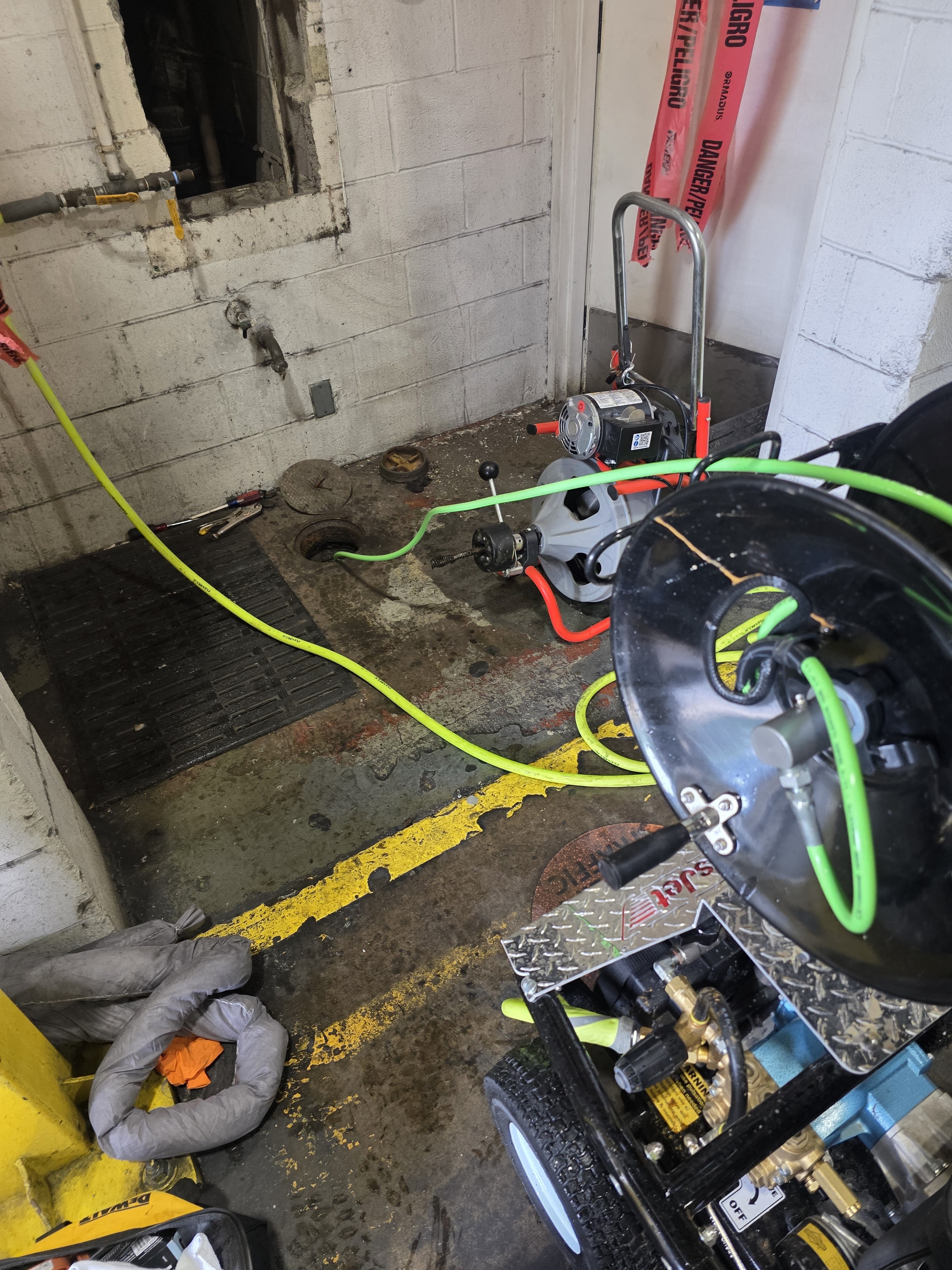 Hydro-jetting service on a commercial floor drain