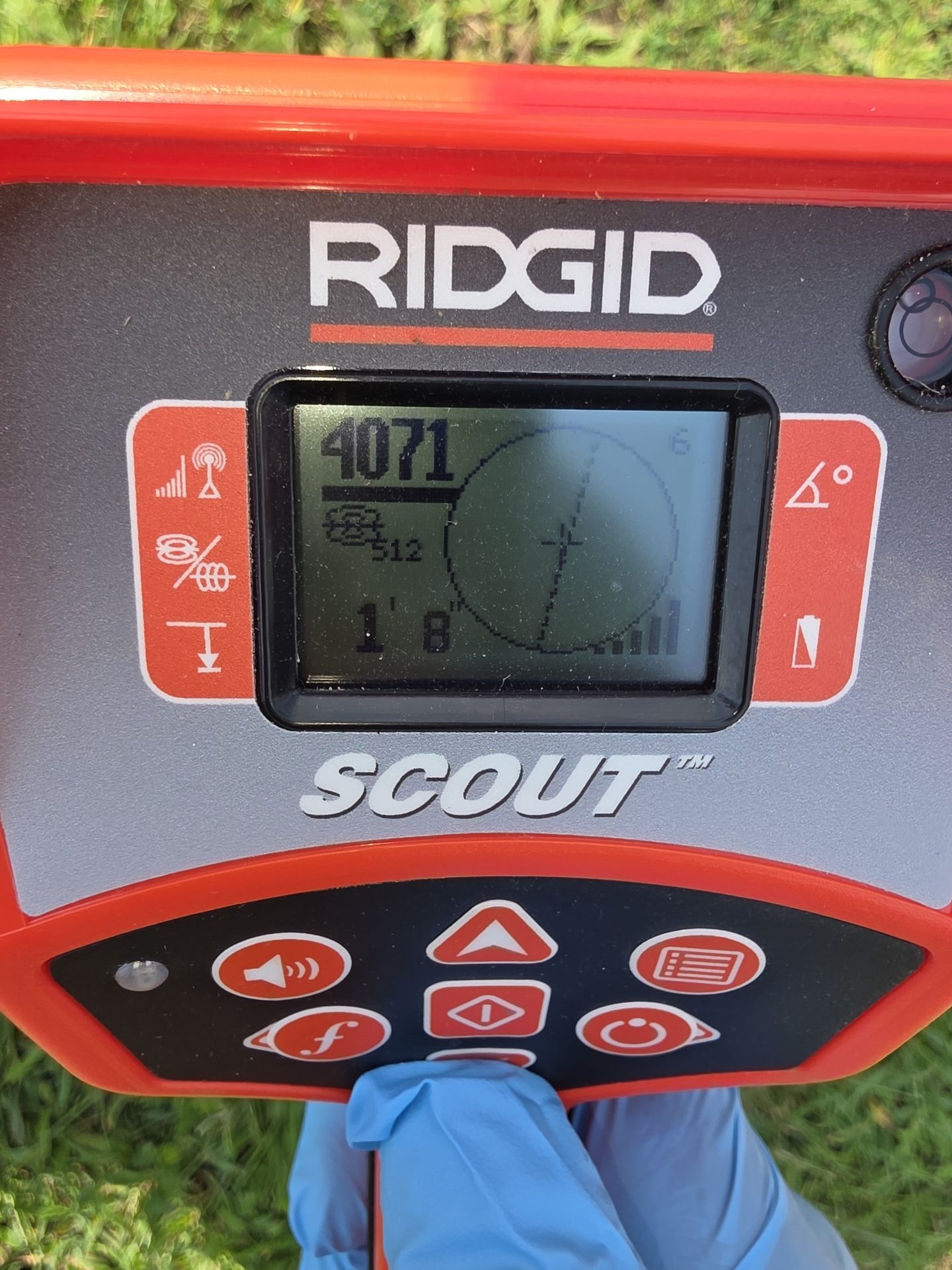 RIDGID Scout locator reading an underground line signal